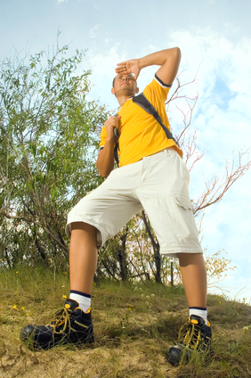 Young man hiker on the hill